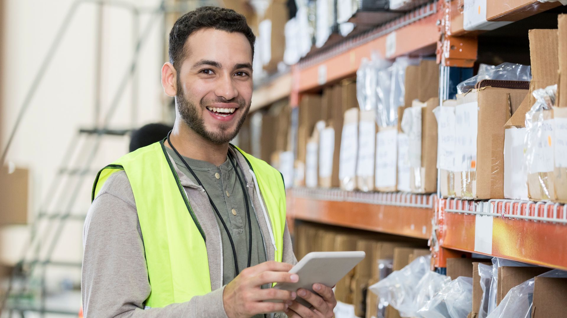 Young male worker smiles after finding work through APM Employment Services