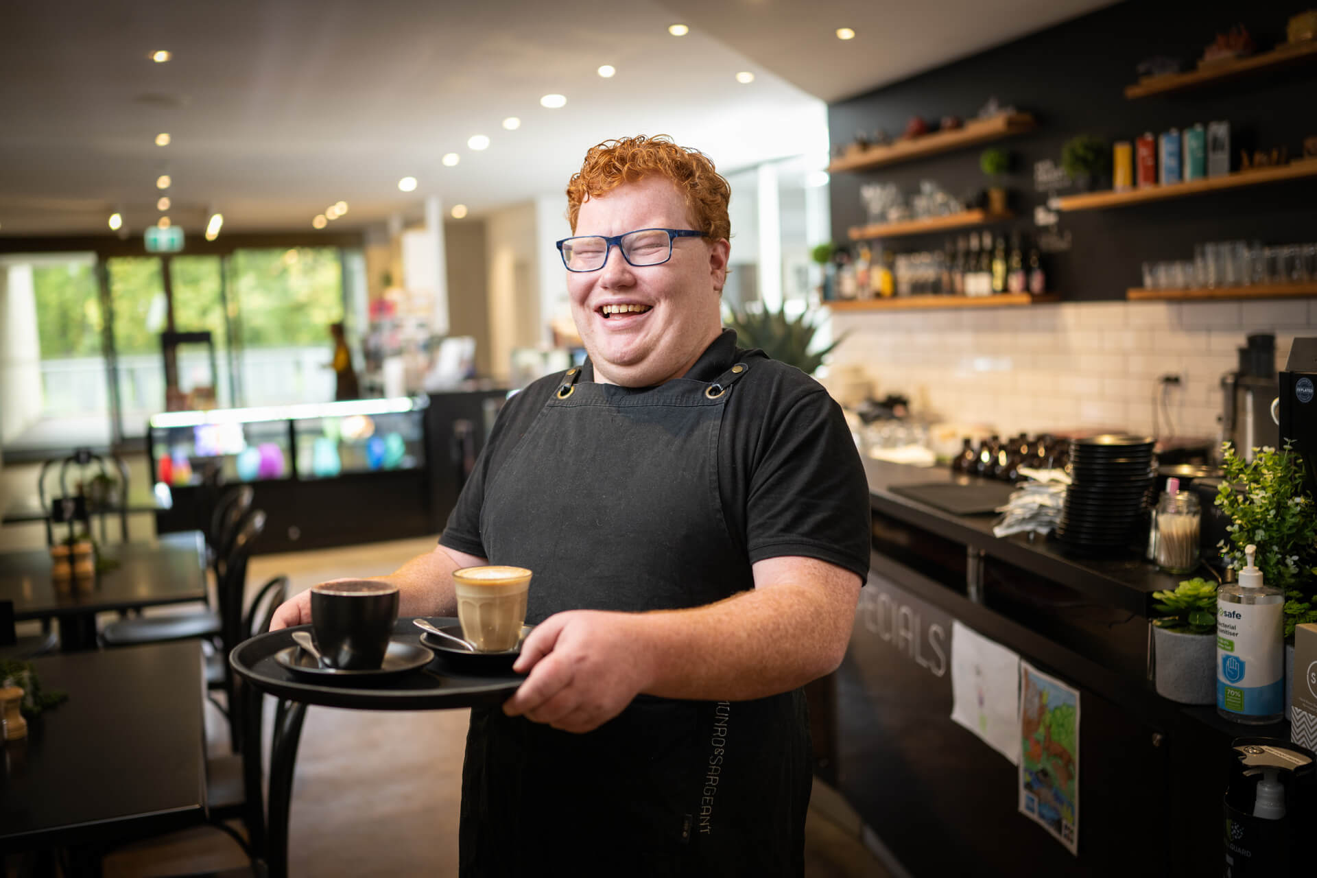 Andrew serving coffee