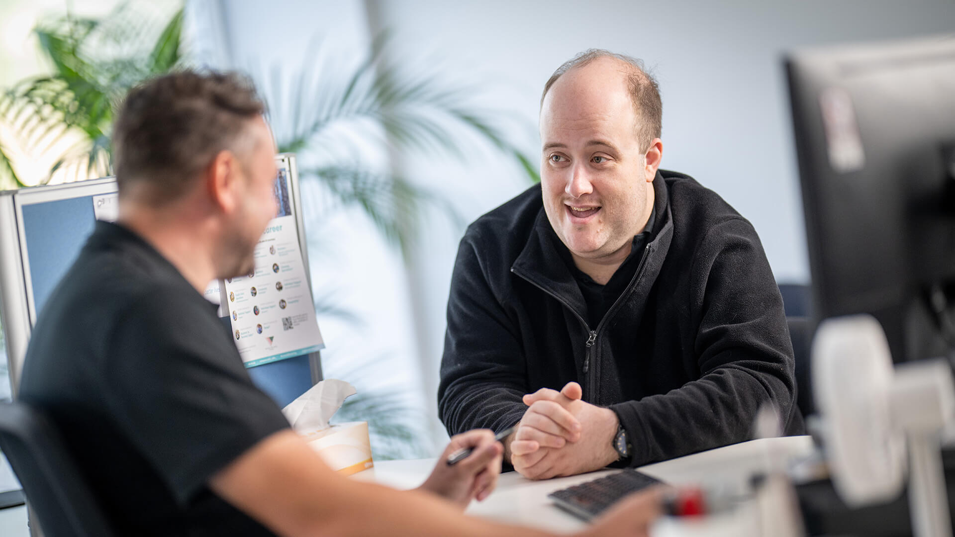 DES participant Stephen smiles with an APM employment consultant